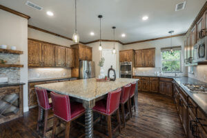 Alder wood cabinets and leather granite island