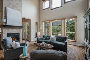 Family room has cathedral ceilings, two sided fireplace with stacked stone.